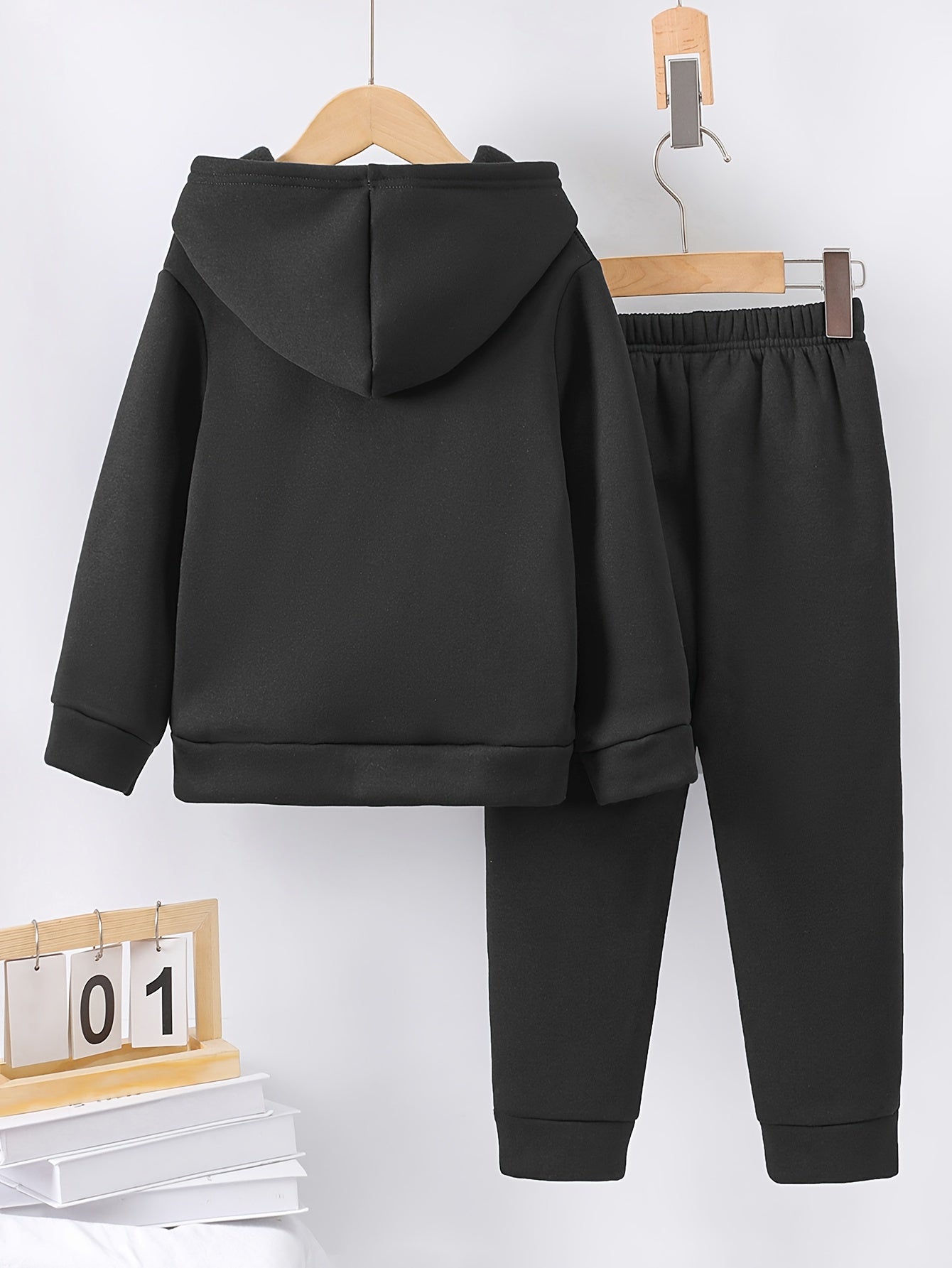 A Boy's Hooded Sweatshirt And Sports Pants With Train Pattern Print