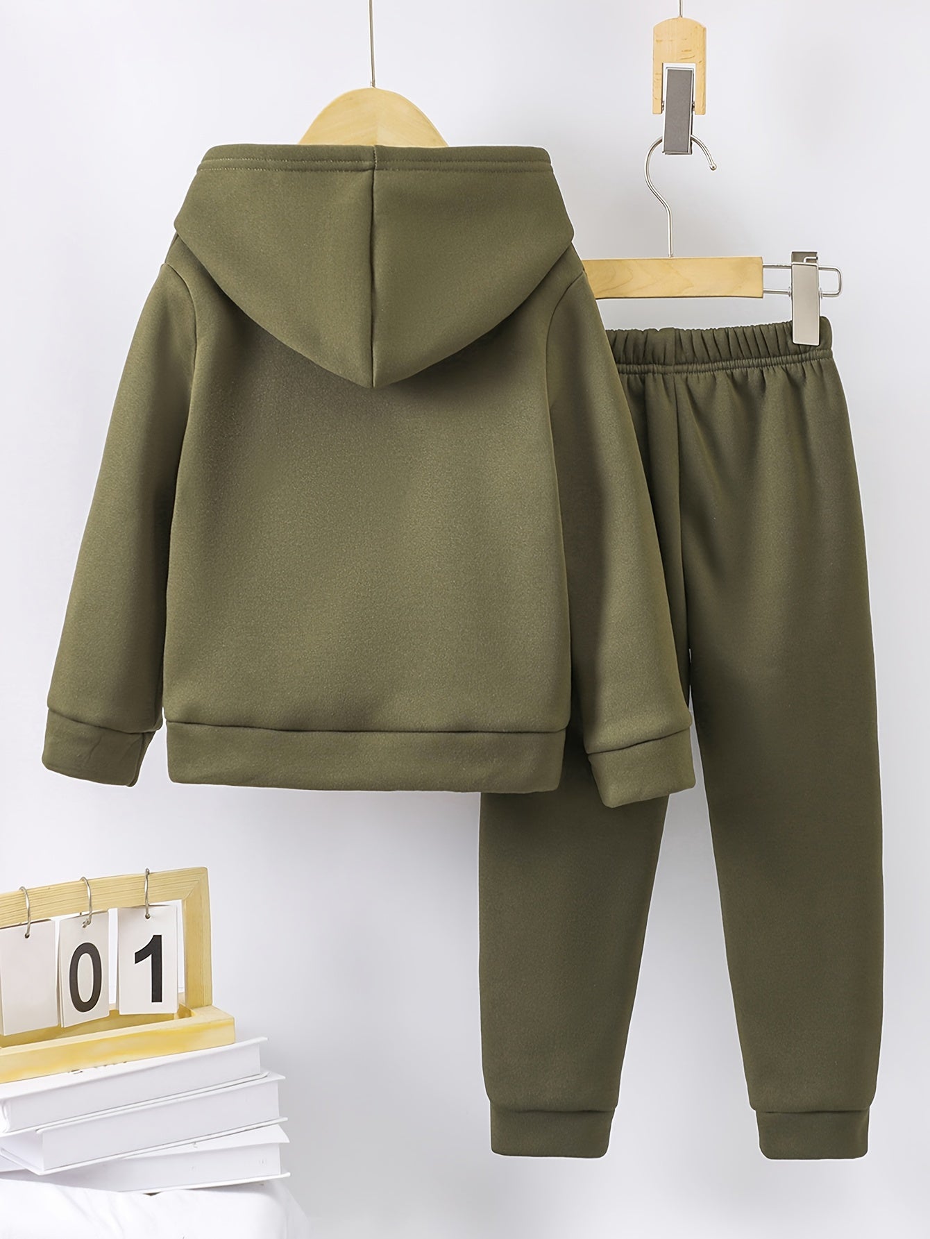 A Boy's Hooded Sweatshirt And Sports Pants With Train Pattern Print