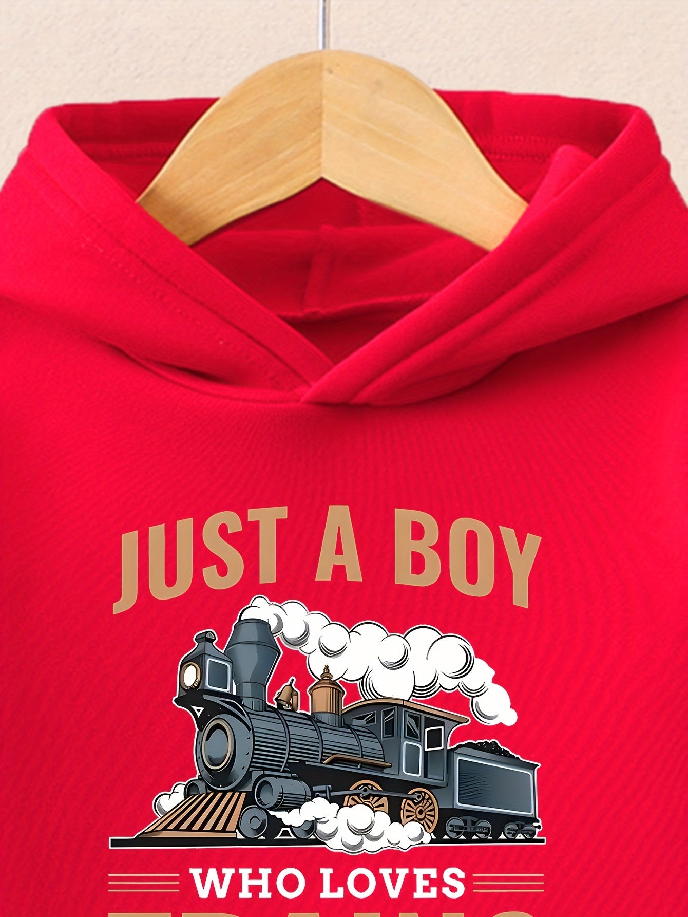A Boy's Hooded Sweatshirt And Sports Pants With Train Pattern Print