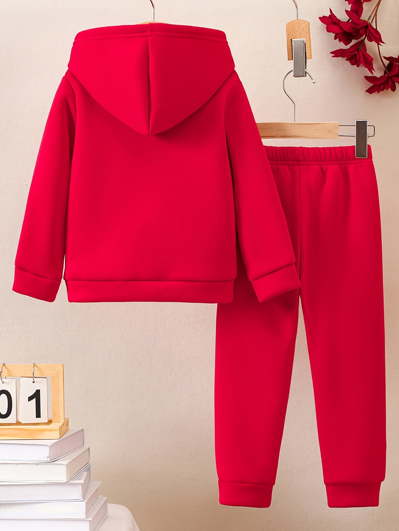 A Boy's Hooded Sweatshirt And Sports Pants With Train Pattern Print